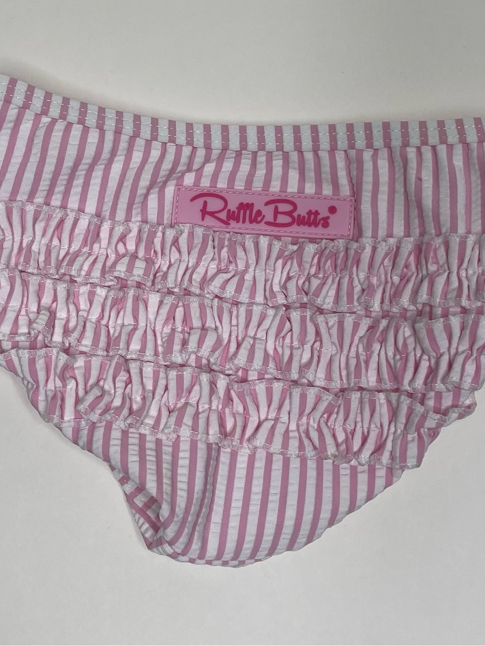 RuffleButts Baby Girls 6β12M Pink White Seersucker Stripe Ruffle Swim Bottom